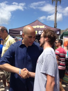 Cory Booker and Charles Measley. Bill Bradley in the background, left.