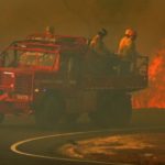 N.J. forest fire that destroyed buildings, damaged homes still burning. Firefighter critically injured.